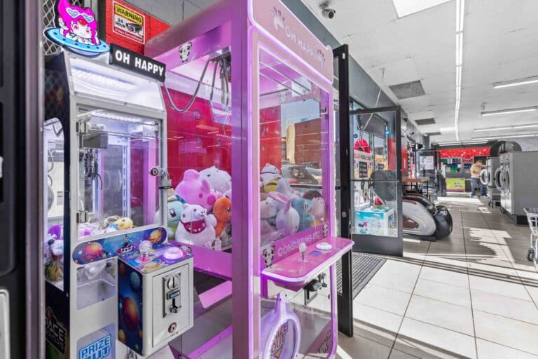 Pink claw machine inside 24/7 laundry near USC for customer entertainment